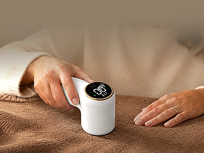 Using the NoFuzz fabric shaver on a sweater